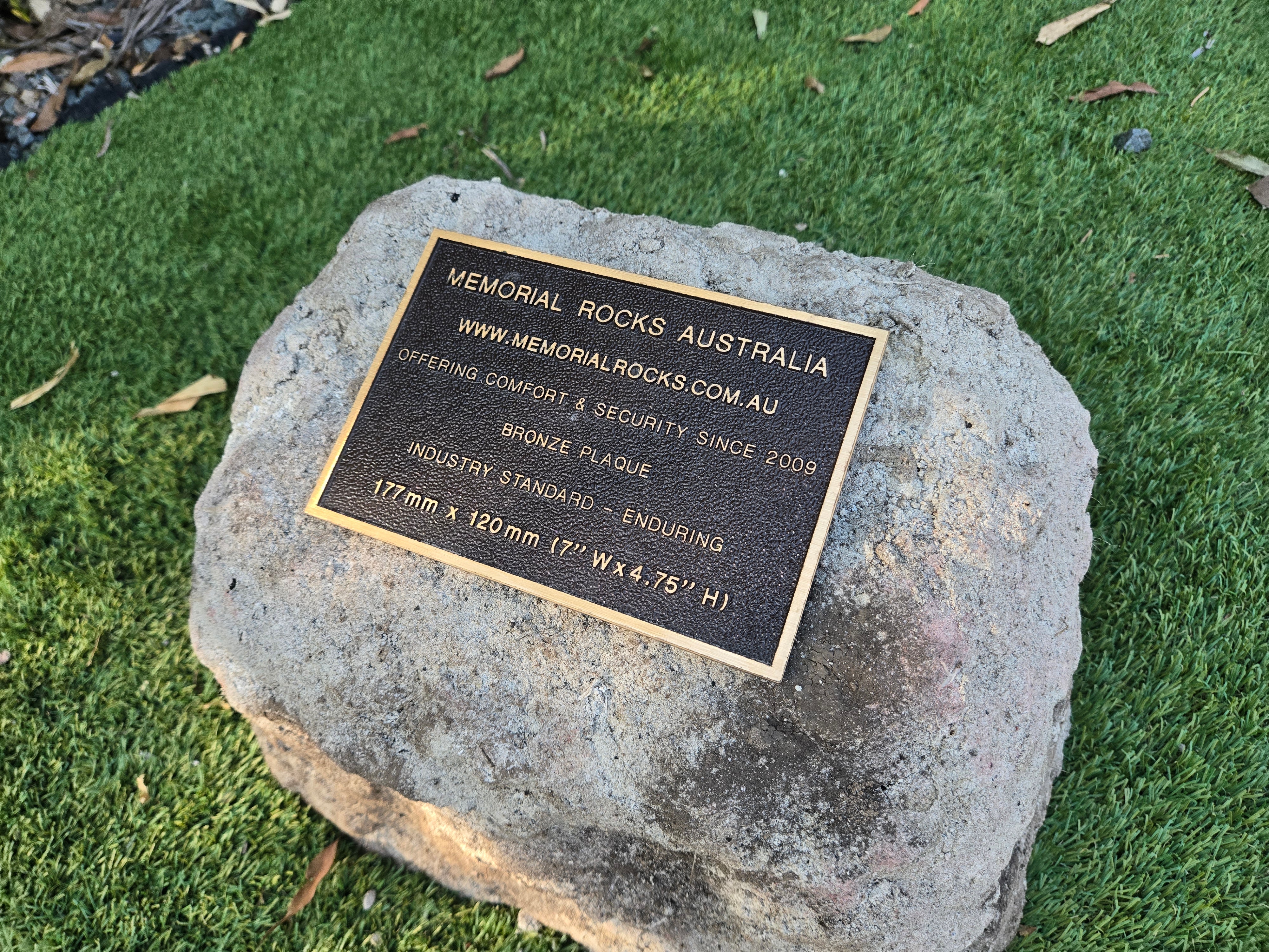 outdoor rock urn and plaque